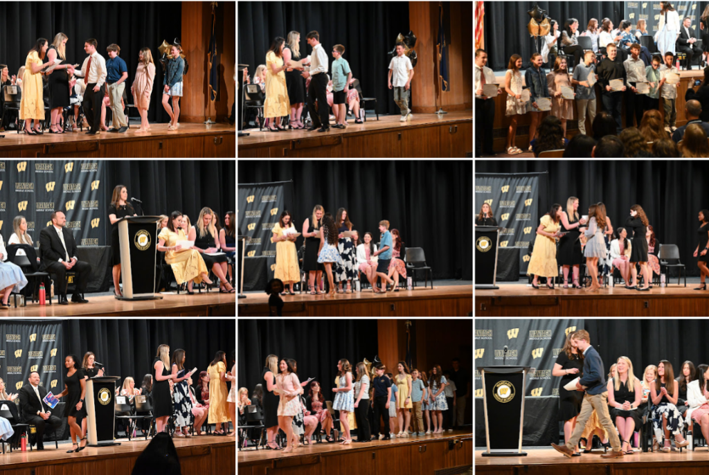 students receiving awards on stage